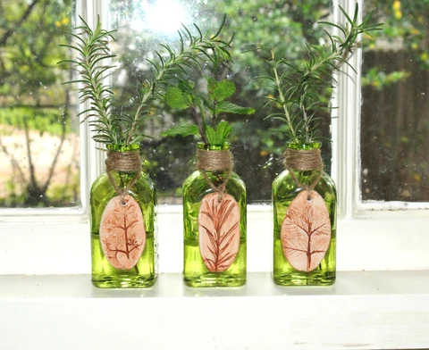 finished air dry clay herb stamped pendants